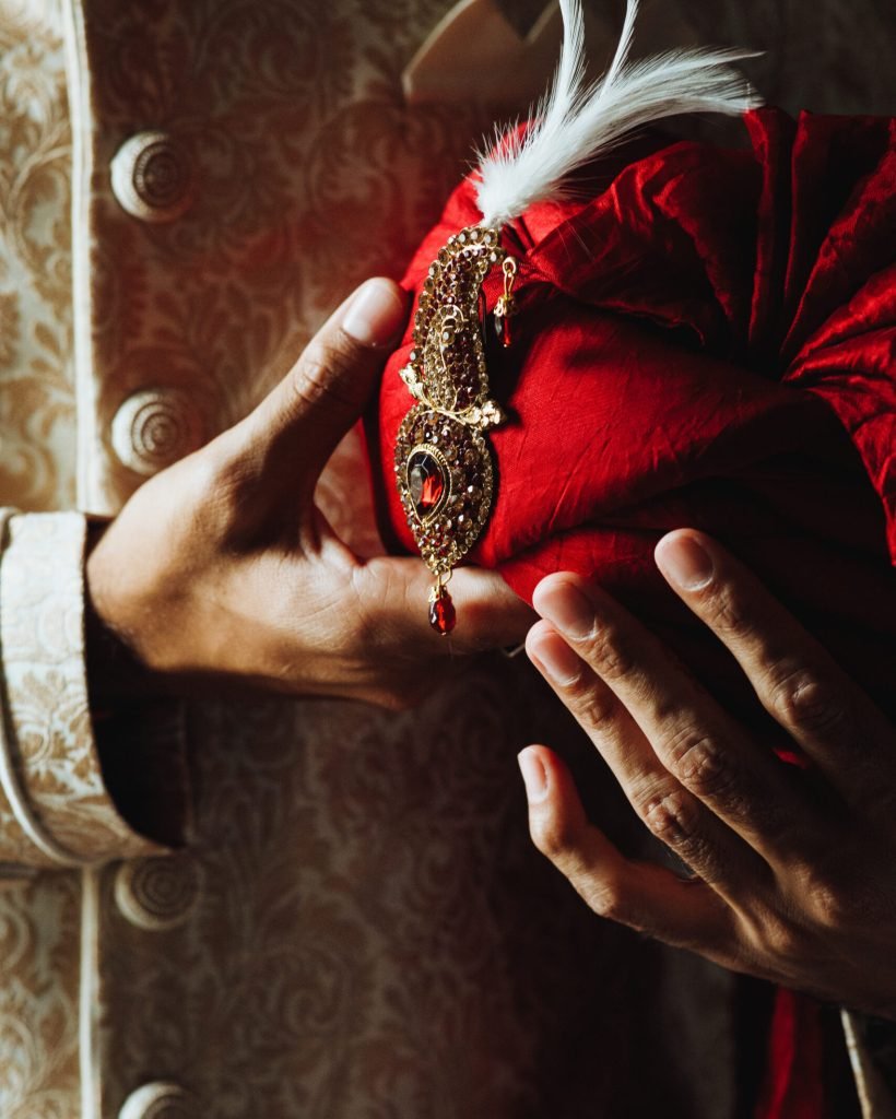 Frontview of traditional indian mans clothes and pagri turban in white and red colours